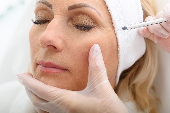 woman undergoing cosmetic injectables procedure